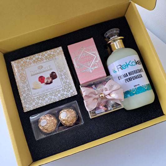 KoketBox - Una miniatura de BADEE AL OUD NOBLE BLUSH  + Crema Perfumada+ Mini Box Hershey's Kisses  y Chocolates